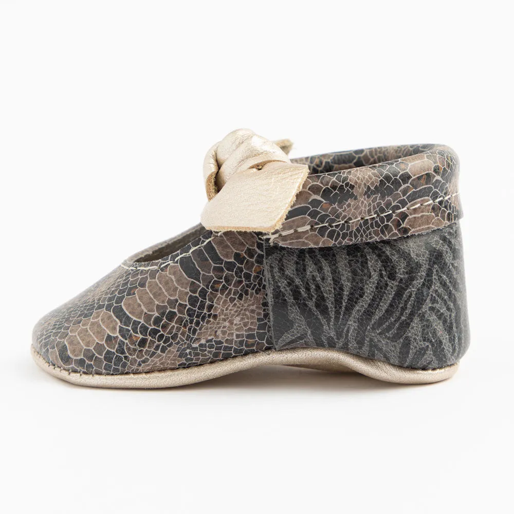 Freshly Picked Platinum Snakeskin Knotted Bow Soft Sole Moccasins